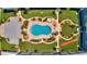 Overhead view of the pool area, shuffleboard, and outdoor recreation areas at 315 N Causeway # B302, New Smyrna Beach, FL 32169