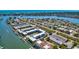 Enjoy this stunning aerial view of the coastal community with boat docks and serene waterfront views at 315 N Causeway # B302, New Smyrna Beach, FL 32169