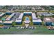 Aerial view highlighting the community's layout, pool, boat docks, and waterfront access at 315 N Causeway # B302, New Smyrna Beach, FL 32169