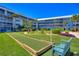 Relaxing outdoor bocce ball court and landscaped common area perfect for leisurely afternoons at 315 N Causeway # B302, New Smyrna Beach, FL 32169