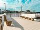 Community dock featuring benches and space for boats to access the water at 315 N Causeway # B302, New Smyrna Beach, FL 32169