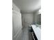 Bright bathroom features tile floors, modern vanity, and a shower/tub combination at 3166 Sweet Acres Pl, St Cloud, FL 34772
