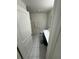Clean bathroom with white tile flooring and a shower with curtain at 3166 Sweet Acres Pl, St Cloud, FL 34772