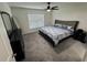 Comfortable bedroom features carpet, a large bed, and a window with natural light at 3166 Sweet Acres Pl, St Cloud, FL 34772
