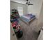 Carpeted bedroom with a twin bed, toys, and a window for natural light at 3166 Sweet Acres Pl, St Cloud, FL 34772