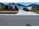 Charming single story home with a well-manicured lawn, driveway and dark blue shutters at 3166 Sweet Acres Pl, St Cloud, FL 34772