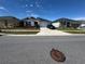 Charming single story home with a well-manicured lawn, driveway and dark blue shutters at 3166 Sweet Acres Pl, St Cloud, FL 34772