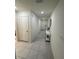 Hallway features tile floors and neutral walls, leading to various rooms in the home at 3166 Sweet Acres Pl, St Cloud, FL 34772