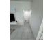 Hallway with tiled flooring, leading to various rooms of the home at 3166 Sweet Acres Pl, St Cloud, FL 34772