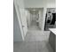 Long hallway with access to the kitchen and other rooms of the home at 3166 Sweet Acres Pl, St Cloud, FL 34772