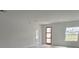 Spacious living room with modern door, recessed lighting and gray floors; plenty of room to relax and unwind at 3519 Sw 131St Place St, Ocala, FL 34473