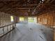 View of the interior of a home under construction with wood framing, block walls and open ceiling beams at 3627 Lincoln St, Sanford, FL 32771