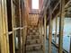 Unfinished staircase, ready for new construction, with exposed wood and room for design upgrades at 3627 Lincoln St, Sanford, FL 32771