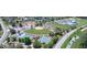 Aerial view of the community showcasing a baseball field, tennis courts, playground and swimming pool at 417 Rio Grande Ct, Kissimmee, FL 34759