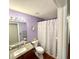 Bathroom featuring a vanity with granite countertop and a shower-tub combo at 417 Rio Grande Ct, Kissimmee, FL 34759