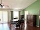 Bright dining area with wood floors, vaulted ceilings, and a modern ceiling fan at 417 Rio Grande Ct, Kissimmee, FL 34759