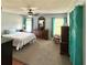 Spacious main bedroom with carpeting, a ceiling fan, and wooden furniture at 417 Rio Grande Ct, Kissimmee, FL 34759