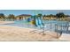 Community pool featuring a slide, wading area, and lounge chairs near the pool house at 417 Rio Grande Ct, Kissimmee, FL 34759