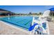 Resort-style swimming pool with crystal-clear water, lifeguard chair, and comfortable lounge seating at 417 Rio Grande Ct, Kissimmee, FL 34759