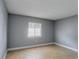 Well lit bedroom with tile flooring, baseboard trim, and large window at 4205 S Semoran Blvd # 3, Orlando, FL 32822