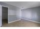 Bedroom featuring an open closet, neutral walls, and tile floors at 4205 S Semoran Blvd # 3, Orlando, FL 32822