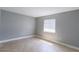 Bright and airy bedroom with tile flooring and a large window with window blinds at 4205 S Semoran Blvd # 3, Orlando, FL 32822