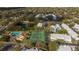 Community aerial view featuring pools, tennis courts, and lush landscapes, showcasing an active lifestyle at 5258 Tunbridge Wells Ln # 1902, Orlando, FL 32812