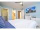 Cozy bedroom with an ensuite bath and large closet featuring custom shelving and storage solutions at 5258 Tunbridge Wells Ln # 1902, Orlando, FL 32812