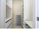 Organized walk-in closet with custom shelving and storage solutions, maximizing space and efficiency at 5258 Tunbridge Wells Ln # 1902, Orlando, FL 32812