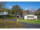 Welcome to Coach Homes at Dover Village, a beautifully maintained community entrance with lush landscaping at 5258 Tunbridge Wells Ln # 1902, Orlando, FL 32812