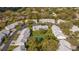 Aerial view of a condominium community showcasing mature trees, manicured lawns and shared amenities at 5258 Tunbridge Wells Ln # 1902, Orlando, FL 32812