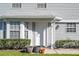 Inviting front door enhanced by potted plants and lush green shrubbery, creating a warm and welcoming entrance at 5258 Tunbridge Wells Ln # 1902, Orlando, FL 32812