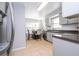 Bright eat-in kitchen featuring stainless steel appliances, granite countertops, and neutral tile flooring at 5258 Tunbridge Wells Ln # 1902, Orlando, FL 32812