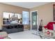 Inviting living room displaying a large television, comfortable seating, and neutral color scheme at 5258 Tunbridge Wells Ln # 1902, Orlando, FL 32812