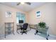 Home office with a sleek glass desk setup, offering a modern and functional workspace at 5258 Tunbridge Wells Ln # 1902, Orlando, FL 32812