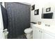 Cozy bathroom includes vanity and shower with gray accents at 558 Tyler Ave, Deltona, FL 32725