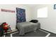 This bedroom features a twin bed, area rug, and window with a cheerful, patterned curtain at 558 Tyler Ave, Deltona, FL 32725