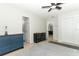 Simple bedroom with a ceiling fan and two doors leading to bathroom and living areas at 558 Tyler Ave, Deltona, FL 32725