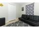 Spare bedroom with a black futon, gray rug and a gaming theme at 558 Tyler Ave, Deltona, FL 32725