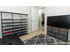 Relaxing spare bedroom with tv and shoe storage unit at 558 Tyler Ave, Deltona, FL 32725