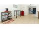 Bright dining area with coffee station and red retro refrigerator on neutral ceramic tile at 558 Tyler Ave, Deltona, FL 32725