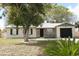 Charming single-story home with stone facade and a well-maintained front yard with mature shade trees at 558 Tyler Ave, Deltona, FL 32725