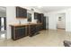 Modern kitchen with contrasting cabinetry, wood countertops, and stainless steel appliances at 558 Tyler Ave, Deltona, FL 32725