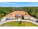 Sprawling estate with circular drive, mature landscaping, and distinct architecture at 6005 Bancroft Blvd, Orlando, FL 32833
