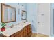 Charming bathroom with a double vanity and bright blue walls at 6005 Bancroft Blvd, Orlando, FL 32833