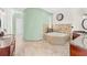 Luxurious bathroom featuring a soaking tub, and vanities with granite countertops, and decorative tile work at 6005 Bancroft Blvd, Orlando, FL 32833