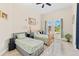 Bright bedroom featuring two twin beds, tiled floors, and a garden view at 6005 Bancroft Blvd, Orlando, FL 32833
