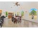 Dining room features a large table and chairs, bright natural light and decorative accents at 6005 Bancroft Blvd, Orlando, FL 32833