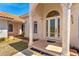 Inviting front entryway featuring columns, arched windows, and a decorative glass front door at 6005 Bancroft Blvd, Orlando, FL 32833
