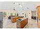 Gourmet kitchen with dual islands, custom cabinets, and stainless steel appliances at 6005 Bancroft Blvd, Orlando, FL 32833